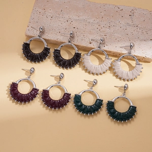 Retro geometric leather hoop earrings in black, cream, dark brown, and deep green