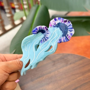 Blue acetic acid jellyfish hair claw clip with purple dotted patterns and starry design
