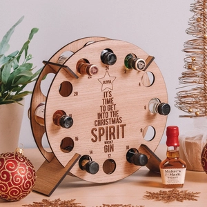Custom wooden Christmas advent wine rack with 24 mini bottle slots and holiday engraving
