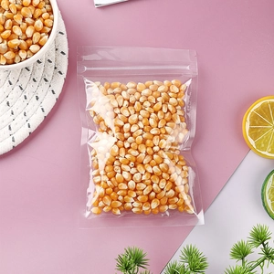 Clear plastic resealable bag filled with corn kernels on a decorative kitchen table