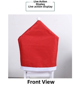 Detail view of the red non-woven Christmas hat chair cover with white plush trim and pompom
