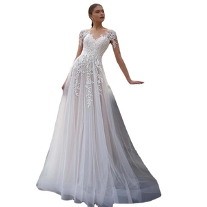 Elegant A-line ivory wedding dress with deep V-neck, lace embroidery, and long mesh sleeves