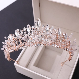 Macro shot of rose gold bridal crown with sparkling crystal beads and rhinestones