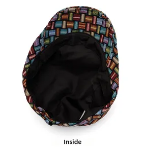 Detail view of colorful checkered woven fabric and black inner lining of the beret hat