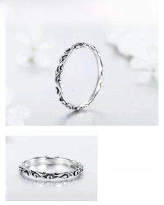 Detailed macro view of S925 sterling silver ring with vintage vine engraving patterns