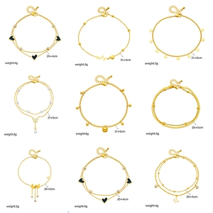 Collection of nine gold titanium steel anklets with heart and butterfly charms