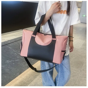 Detail of pink and black fitness bag with waterproof fabric and wet-dry separation side zip