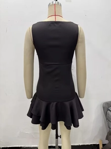 Back view of black sleeveless mini dress with layered ruffle hem and slim fit cut