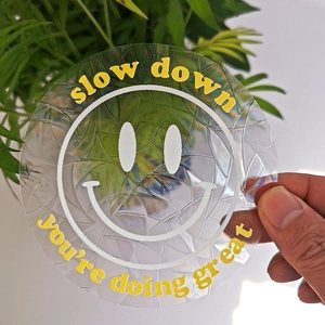 Rainbow suncatcher decal with smiley face and slow down text on holographic film