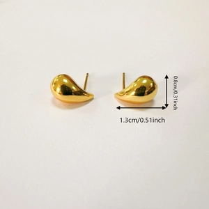 Detail showing dimension of gold teardrop earrings measuring 1.3cm wide and 0.8cm high