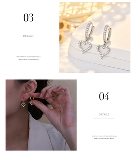 Detail of luxury geometric heart hoop earrings with zircon inlay in silver and gold finish