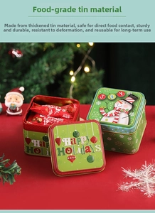 Close-up of festive Christmas square tin box with snowman design for candy and gifts
