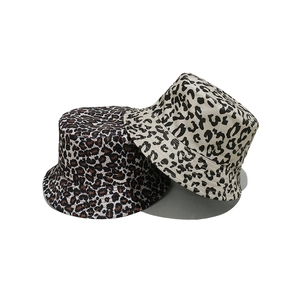 Close-up of leopard print bucket hats showing high-quality twill cotton and stitching details