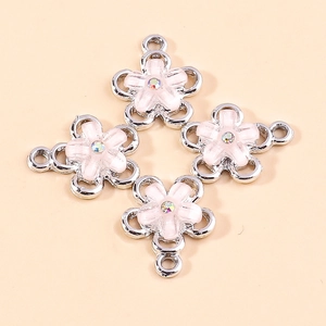 Pink flower charm pendants with sparkling rhinestones and three connection loops