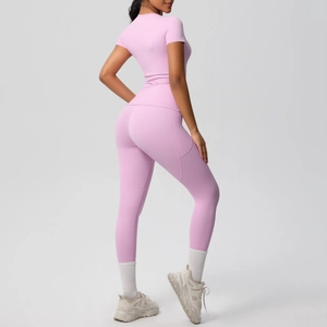 Side view of mauve yoga set featuring slim fit short sleeve top and high waist leggings