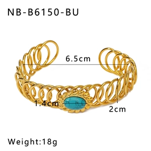 Detail view of gold stainless steel spring bracelet with turquoise stone inlay and dimensions