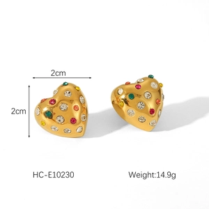 Detail view of heart-shaped 18K gold earrings with multicolor crystals and dimensions