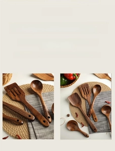 Detail of natural teak wood spatulas and spoons with ergonomic handle holes