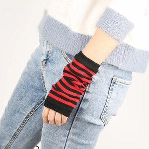 Detail of red and black striped knitted wrist warmers with fingerless punk style design
