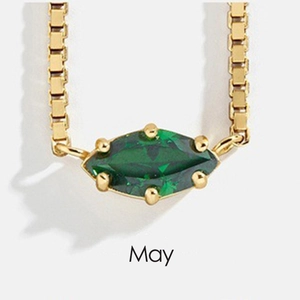 Close-up of May birthstone necklace in 18K gold plated steel with green marquise gem