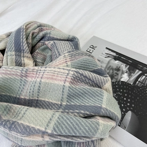 Classic British checkered winter scarf in pastel macaron colors with soft fringe detail
