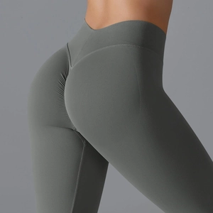Detail showing high-waisted scrunch butt design on dark gray seamless yoga leggings