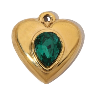 Detail of a heart-shaped gold pendant with a pear-cut green gemstone on a white background