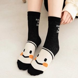 Mid-calf cotton socks in black and white with a happy face and HAVE A NICE DAY print