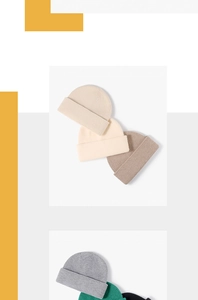 Detailed close-up showing a variety of colorful warm knit beanies for winter fashion
