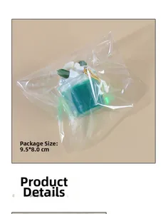 Miniature cream cup keychain in plastic packaging showing size 9.5x8.0cm