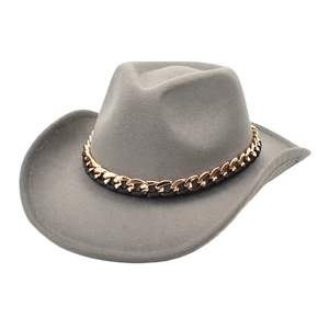 Detail of grey wool fedora featuring a decorative gold chain and black leather band