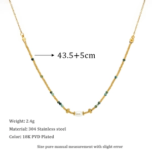 Detail of 18K PVD gold stainless steel necklace with green beads and pearl accent