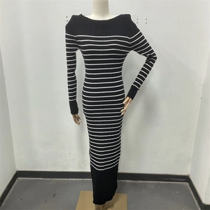 Detail shot of black and white striped knitted maxi dress showing fabric and slim fit