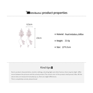 Detailed view of long chiffon petal tassel earrings with measurements and faux pearls