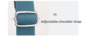 Close-up of adjustable shoulder strap with silver buckle on cyan blue canvas bag