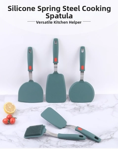Detail of dark green silicone spatulas with stainless steel handles and non-slip grips