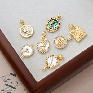 Vintage 14k gold filled shell pendants in various shapes with mother of pearl inlays