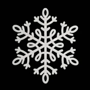 Macro shot of a white plastic snowflake ornament with 3D texture for Christmas decor