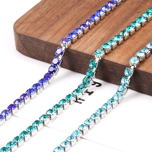 Stainless steel crystal claw chain bracelets in dark blue, teal, and light blue finishes