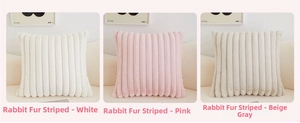 Detailed texture of striped plush faux rabbit fur pillow covers in white, pink, and grey