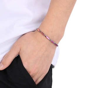 Close-up of rainbow stainless steel diamond chain bracelet on male model wrist