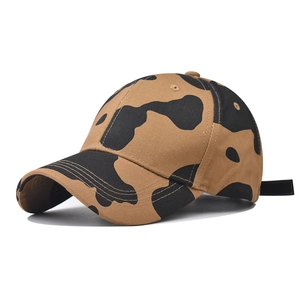 Detail view of the side profile on a brown camo cow print cotton baseball cap