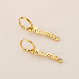 Detail of golden MAMA letter earrings featuring sparkling zircon inlay accents