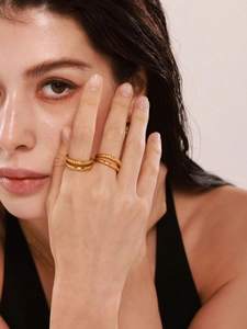 Close-up of dual-layer gold plated stainless steel ring with twisted rope texture details