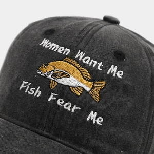 Detail of dark grey washed cotton baseball cap with fish embroidery and funny slogan