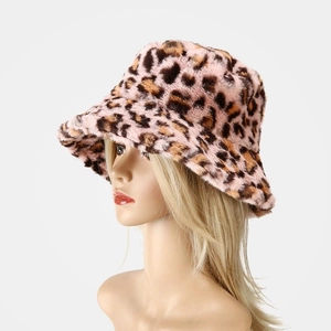 Detailed texture of pink leopard print faux fur winter bucket hat with soft plush finish