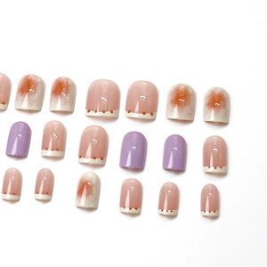 Pastel taro purple press-on nails with French white tips and orange polka dots design