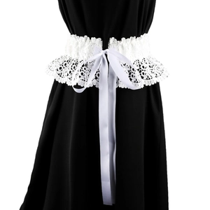 Detailed view of white floral lace corset belt with a central satin bow ribbon tie