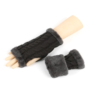 Detail of dark grey cable knit fingerless gloves with soft plush faux fur trim