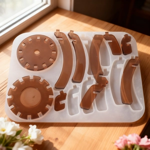 DIY silicone mold for拼接 candle holder with brown resin parts on a wooden table